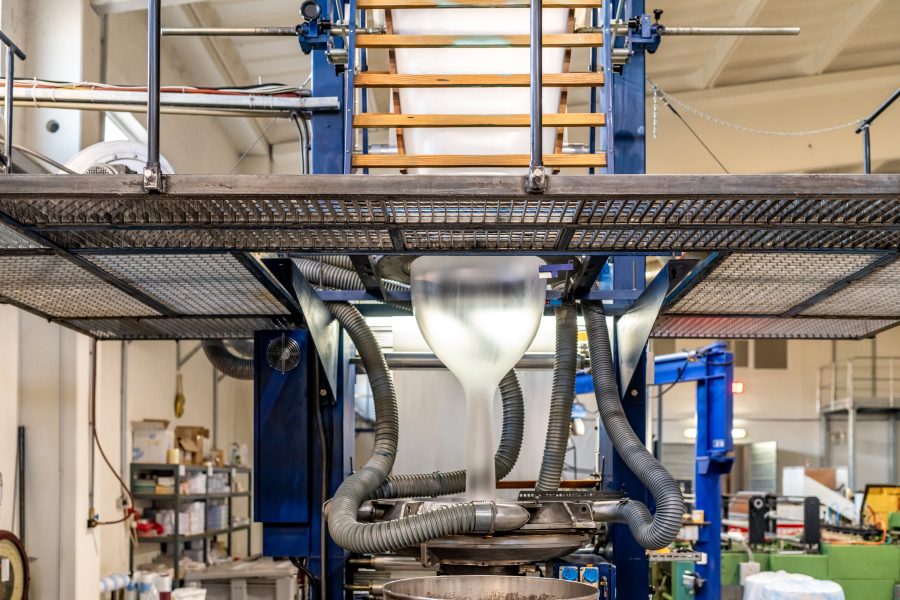 blowing plastic on a machine into a roll for the production of plastic bags.
